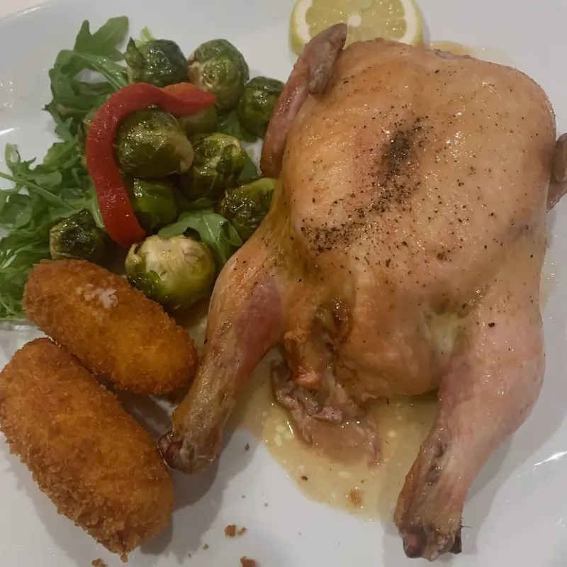 Whole roasted chicken with Brussels sprouts and two croquettes